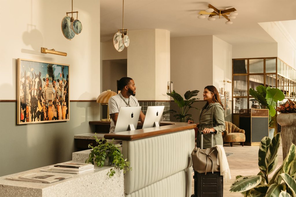 Guest checking in at front desk reception area at Downtown LA hotel
