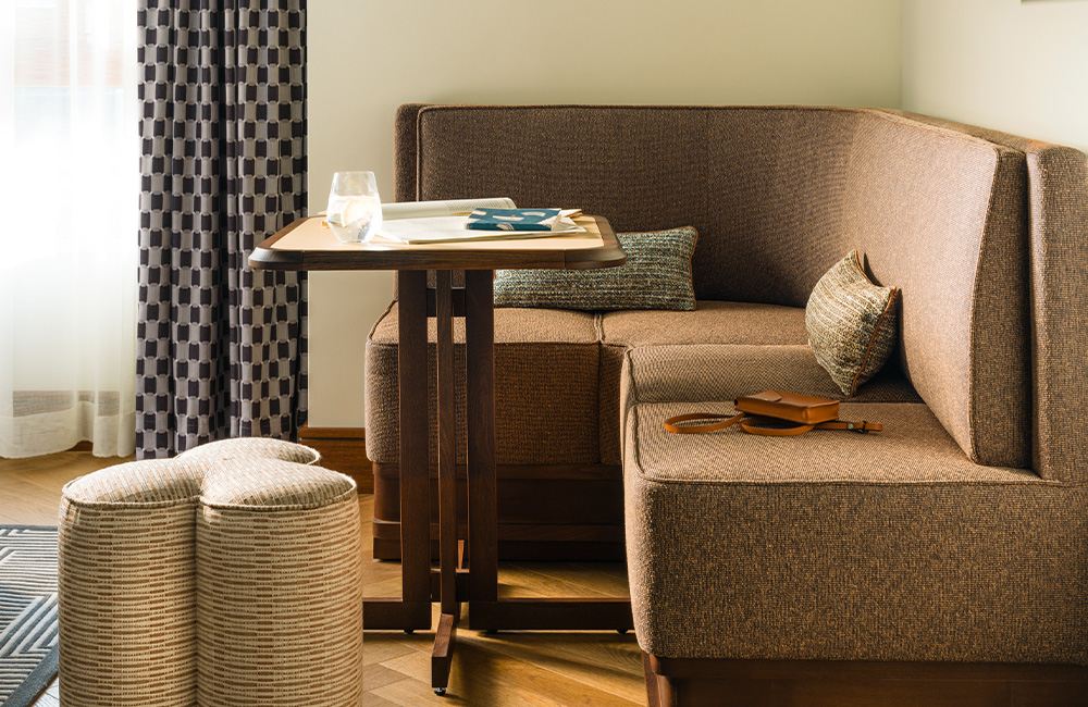 Corner sofa with table and pouffe.