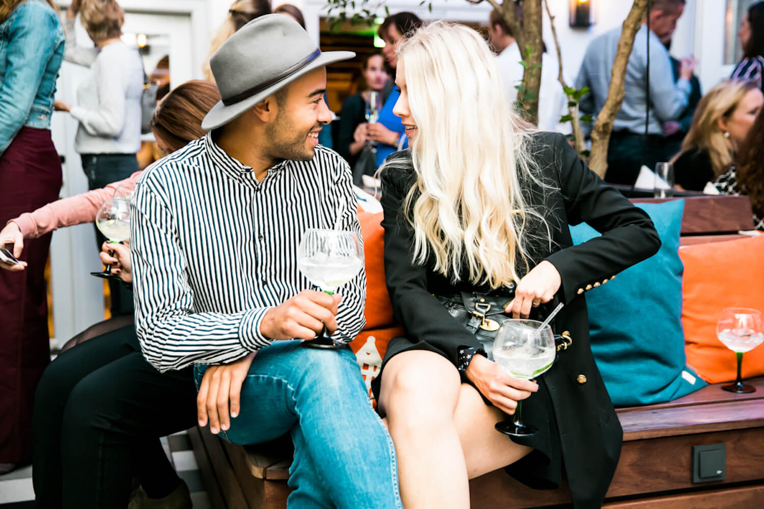 Two people enjoying a drink at a party